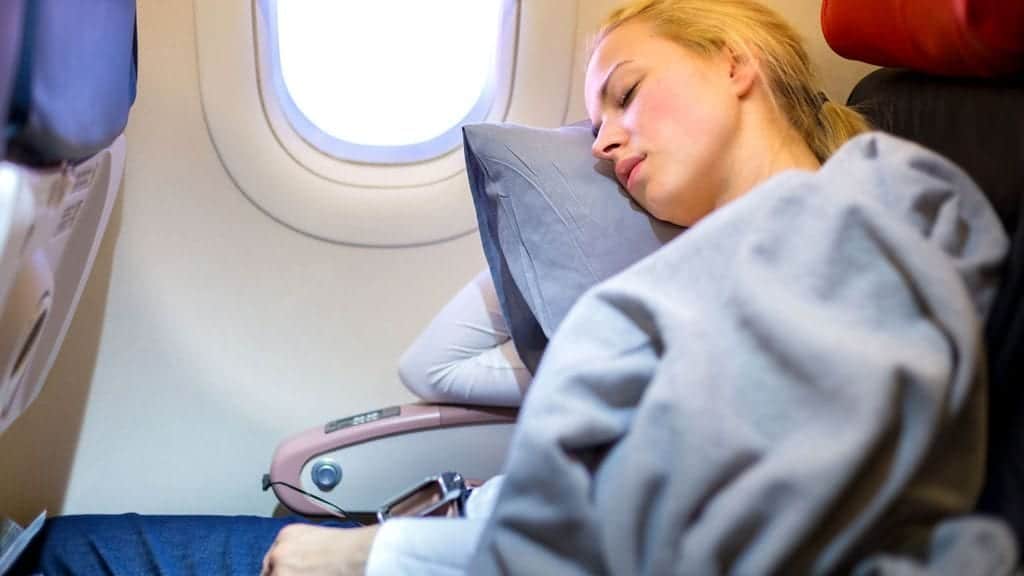 How can I sleep on a plane